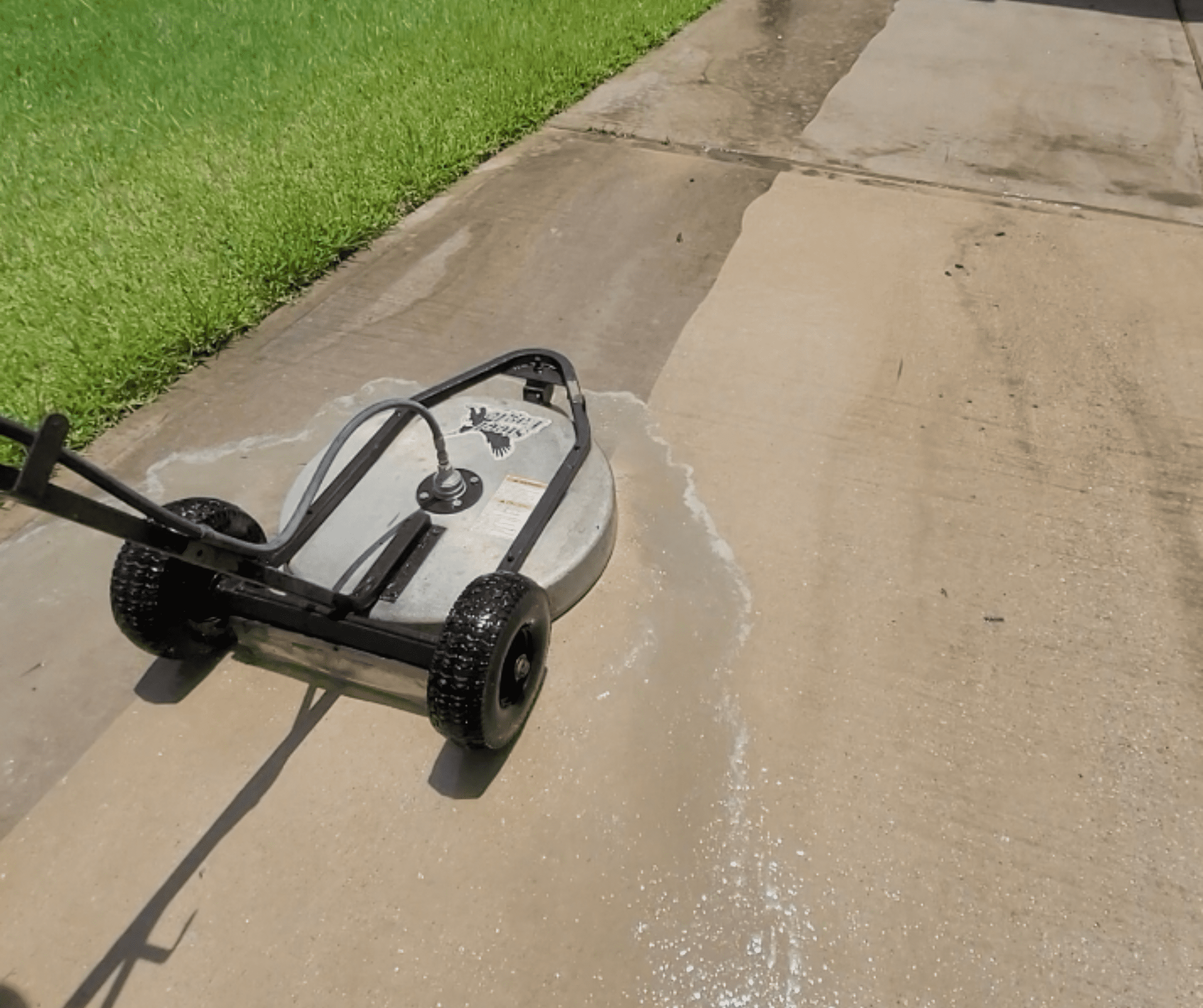 Pressure washing a residential driveway in Houston